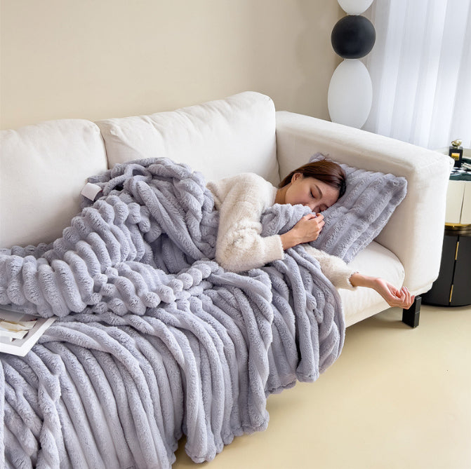 Ribbed faux fur blanket on a sofa
