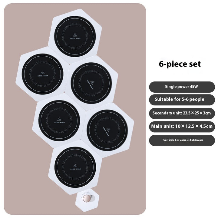 White hexagonal food warming plates joined in a cluster