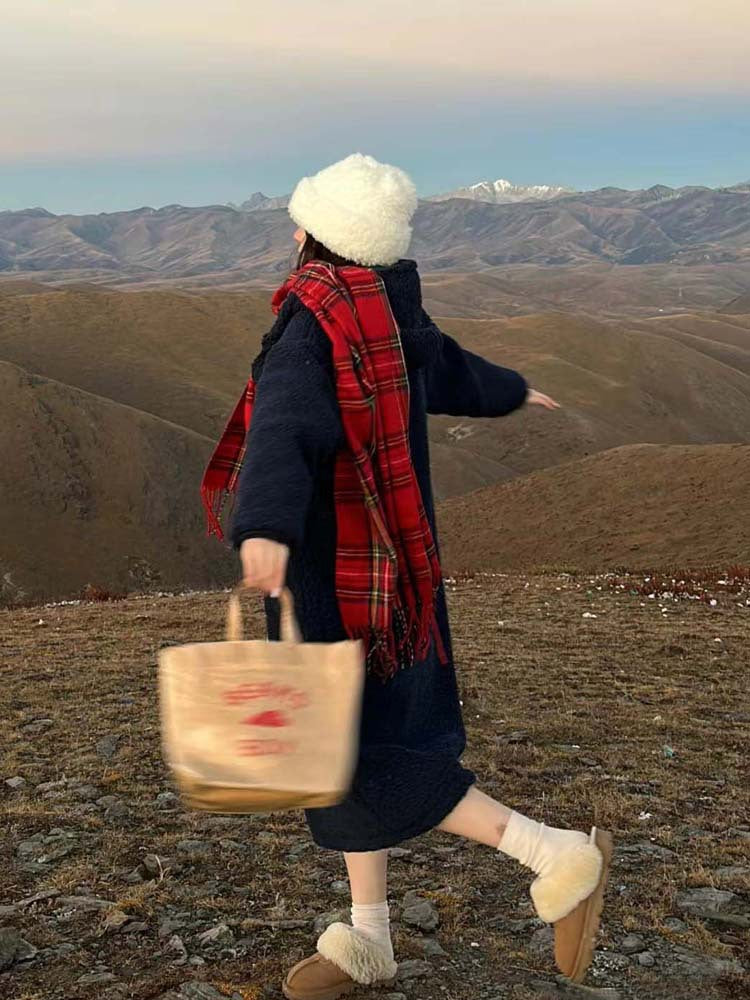 Woman wearing a red tartan scarf