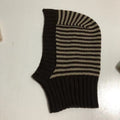 Person wearing striped knit balaclava hood