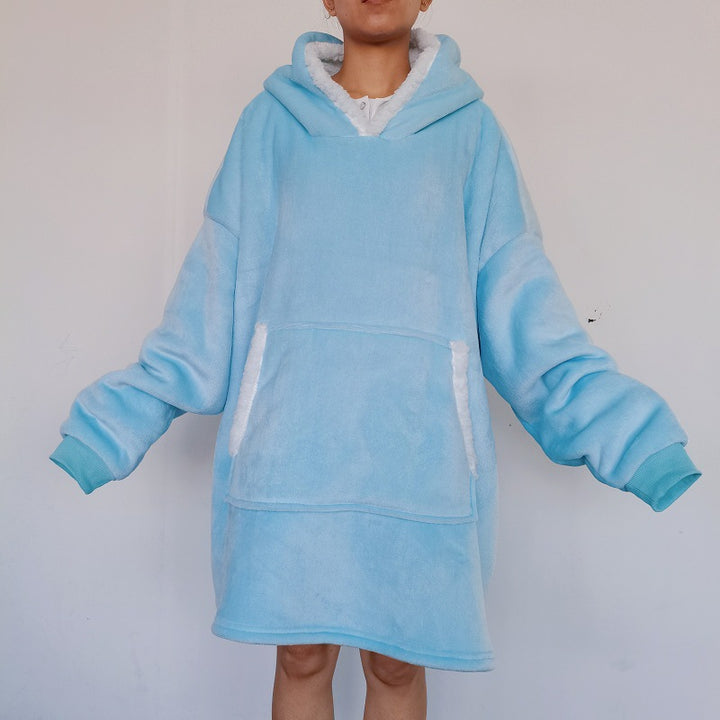 Person wearing an oversized blanket hoodie