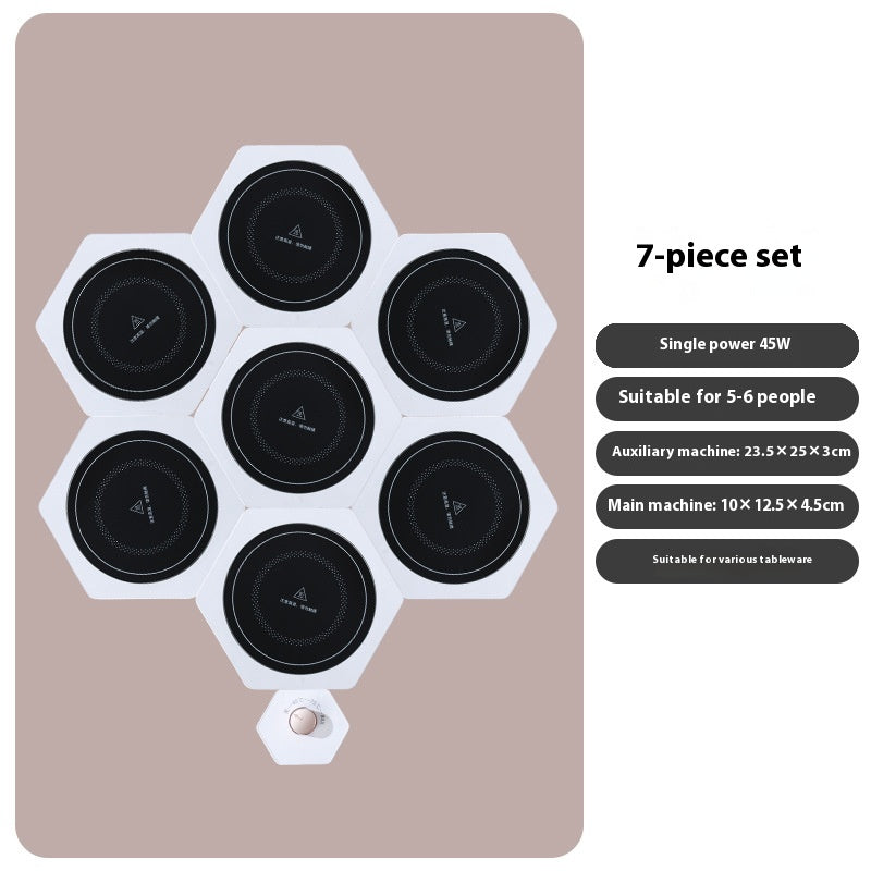 White hexagonal food warming plates joined in a cluster