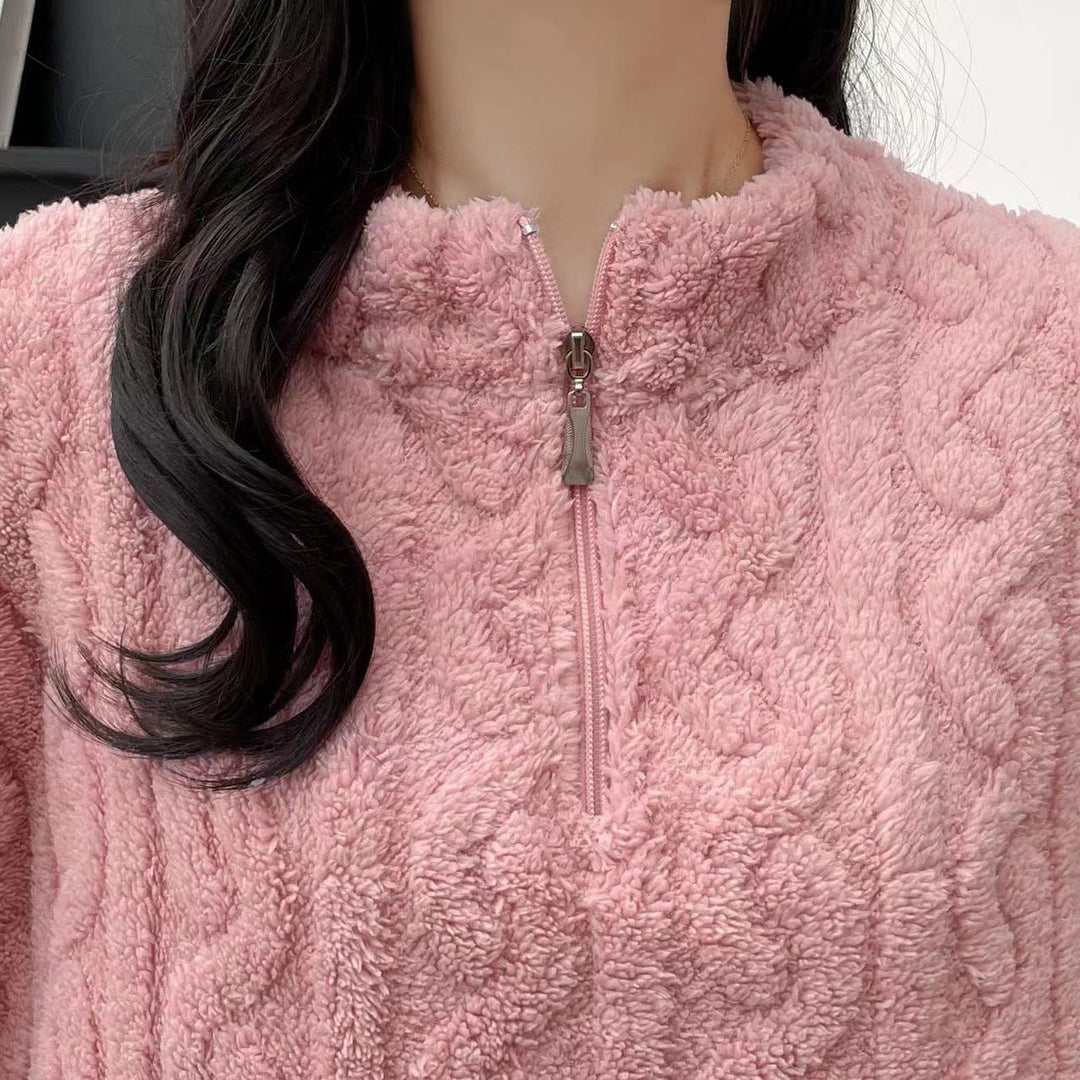 Woman in a half-zip fleece pajama set