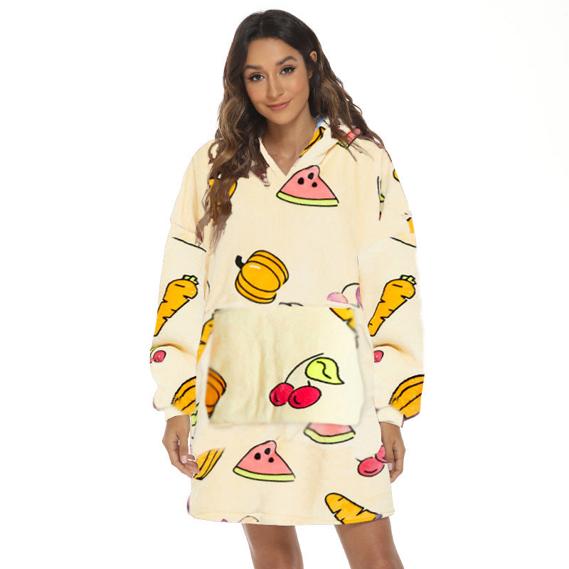 Person wearing oversized hooded blanket