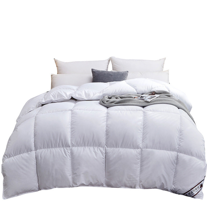 Quilted winter comforter on a made bed