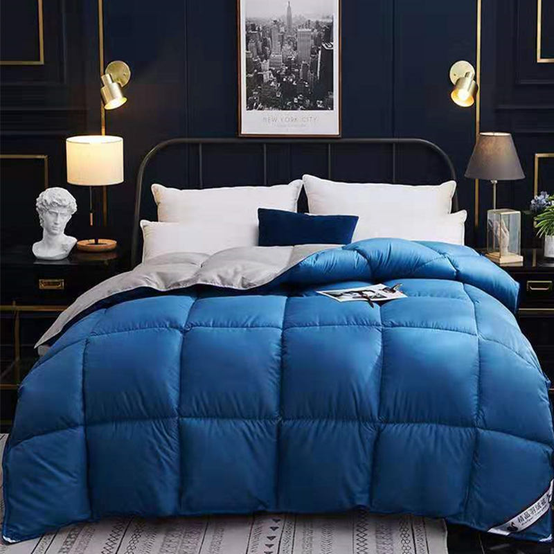 Quilted winter comforter on a made bed