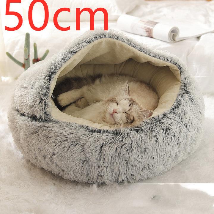 Cat curled up in a round plush bed with hood