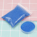 Colorful magic sand in water