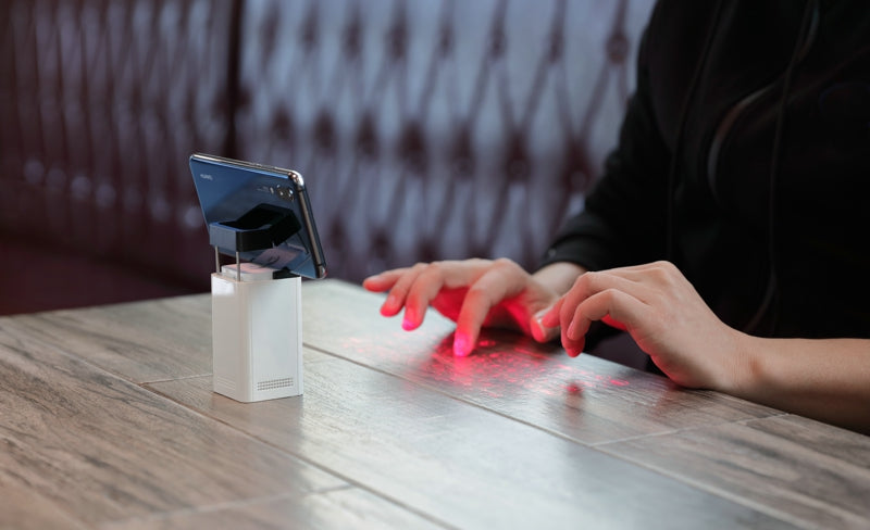 Laser projection keyboard on a table