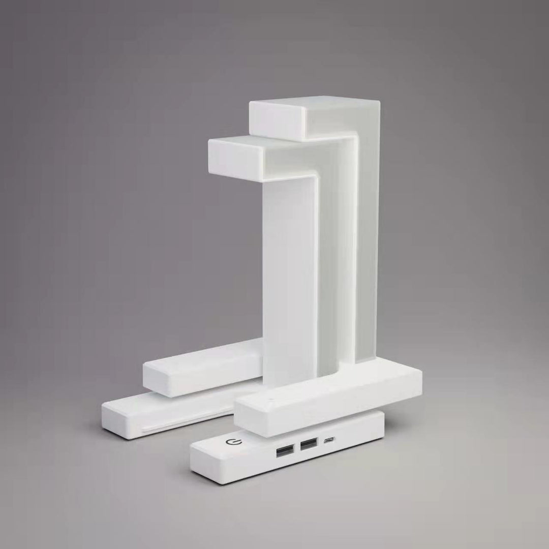 White floating lamp charging a phone