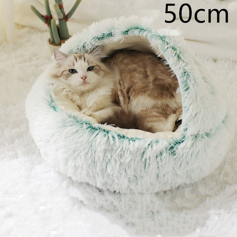 Cat curled up in a round plush bed with hood