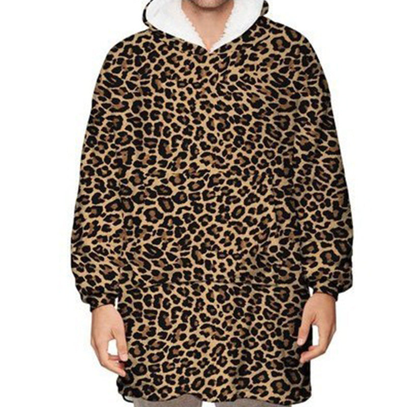 Person wearing oversized hooded blanket