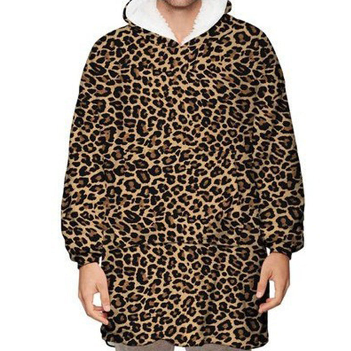 Person wearing oversized hooded blanket