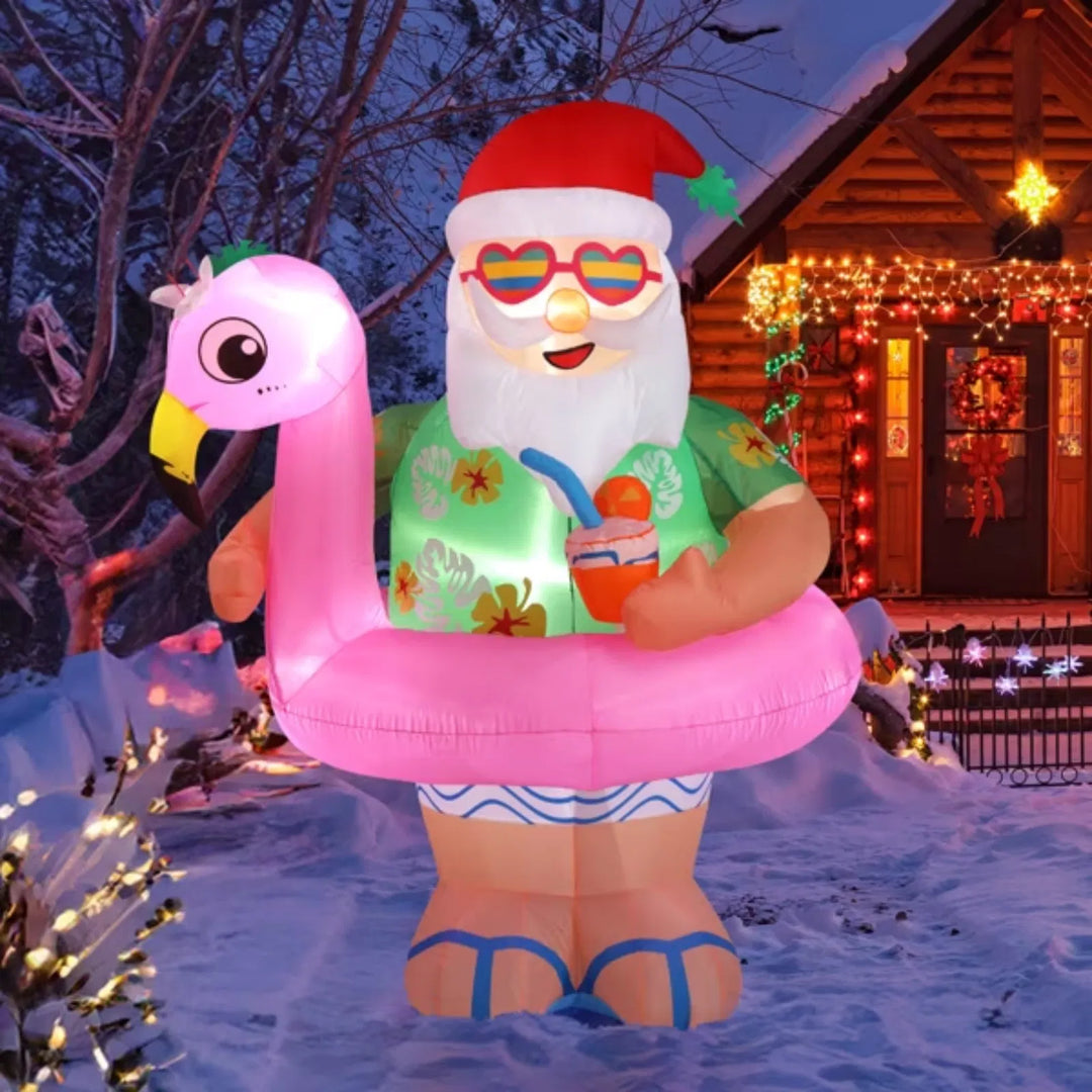 Inflatable Santa on pink flamingo float
