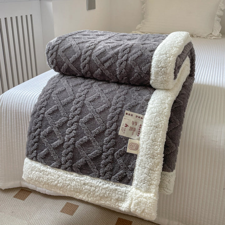 Cable-knit jacquard blanket with sherpa border