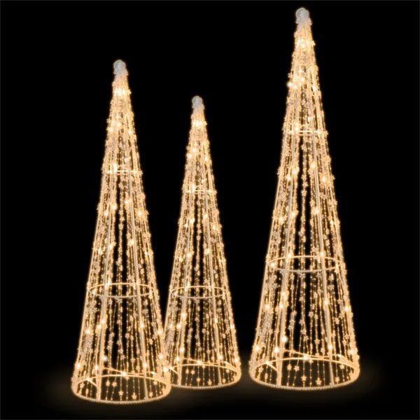 Three lighted cone Christmas trees outdoors