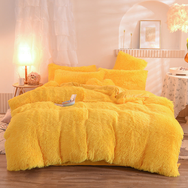Fluffy plush bedding set on a bed