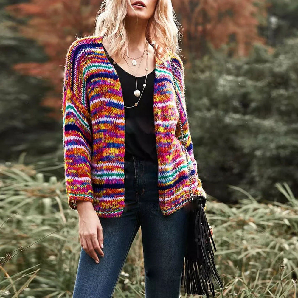 Woman in a rainbow striped chunky cardigan