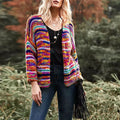 Woman in a rainbow striped chunky cardigan