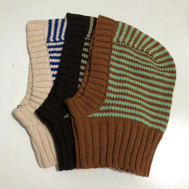 Person wearing striped knit balaclava hood