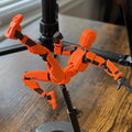 Orange poseable 3D printed robot figure