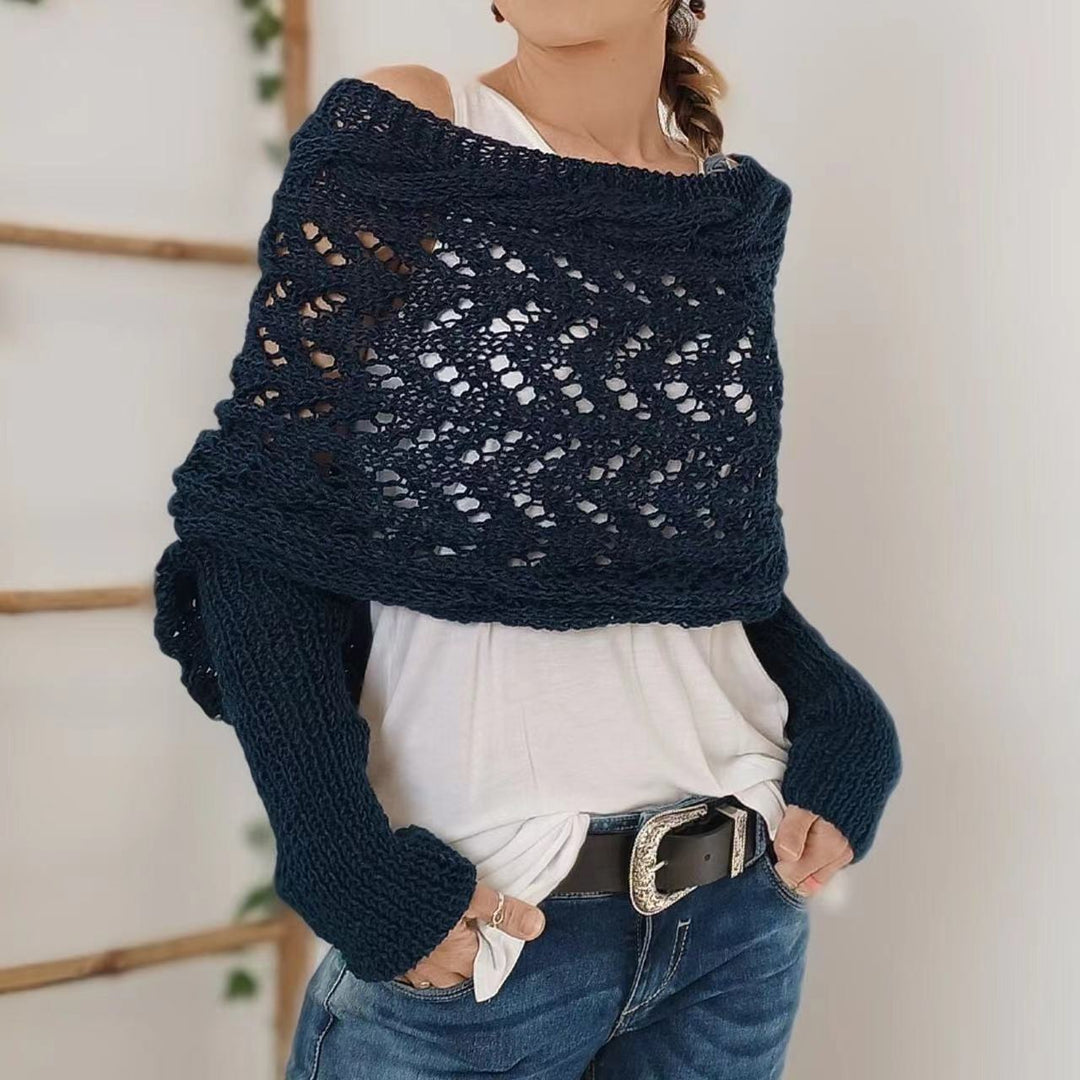 Woman wearing a knit shawl with sleeves