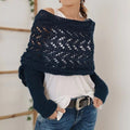 Woman wearing a knit shawl with sleeves