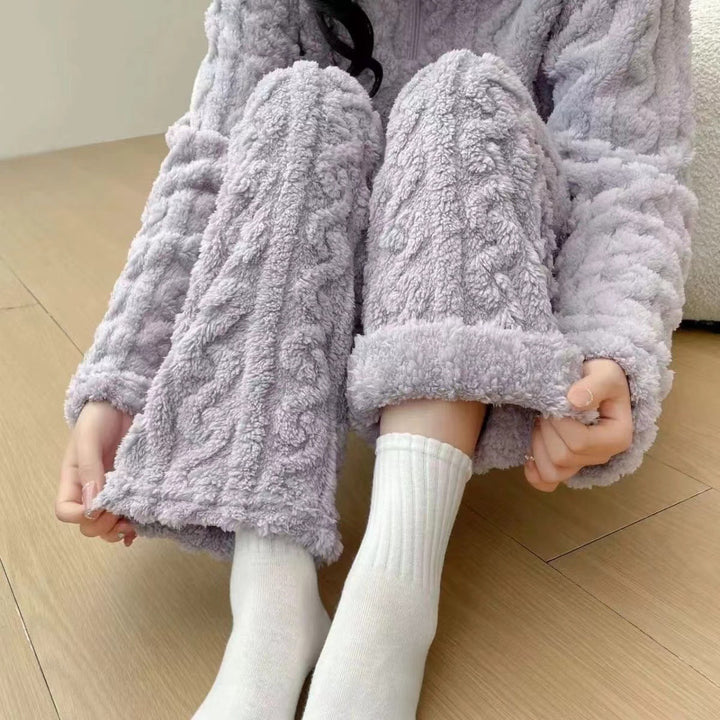 Woman in a half-zip fleece pajama set