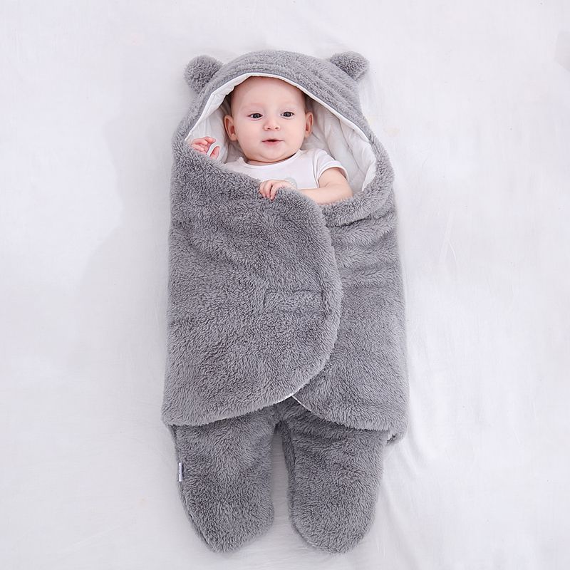 Baby in a bear ear sleep sack