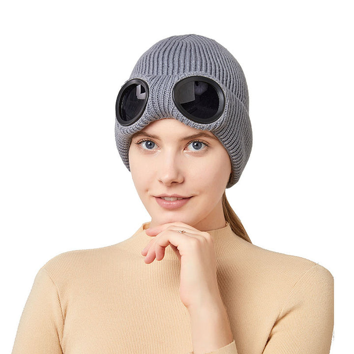 Knit beanie with flip-up goggles on front