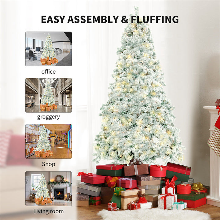 Snow-flocked white Christmas tree with warm-white lights
