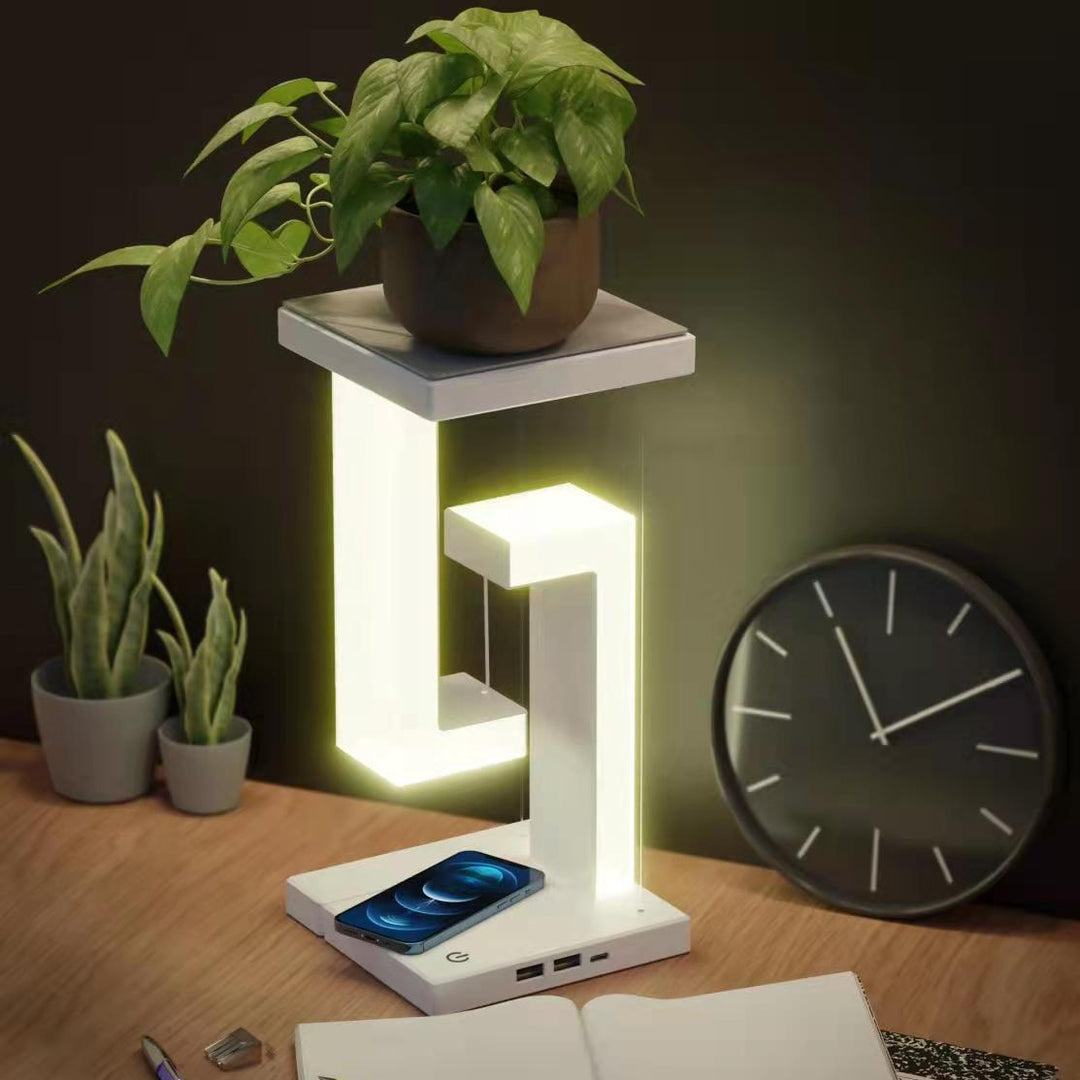 White floating lamp charging a phone