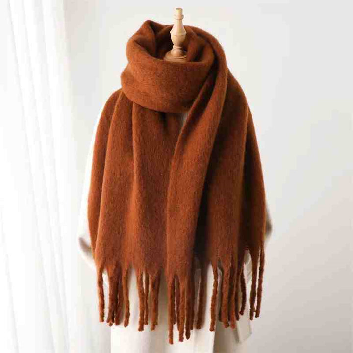 Woman wearing a fluffy mustard scarf