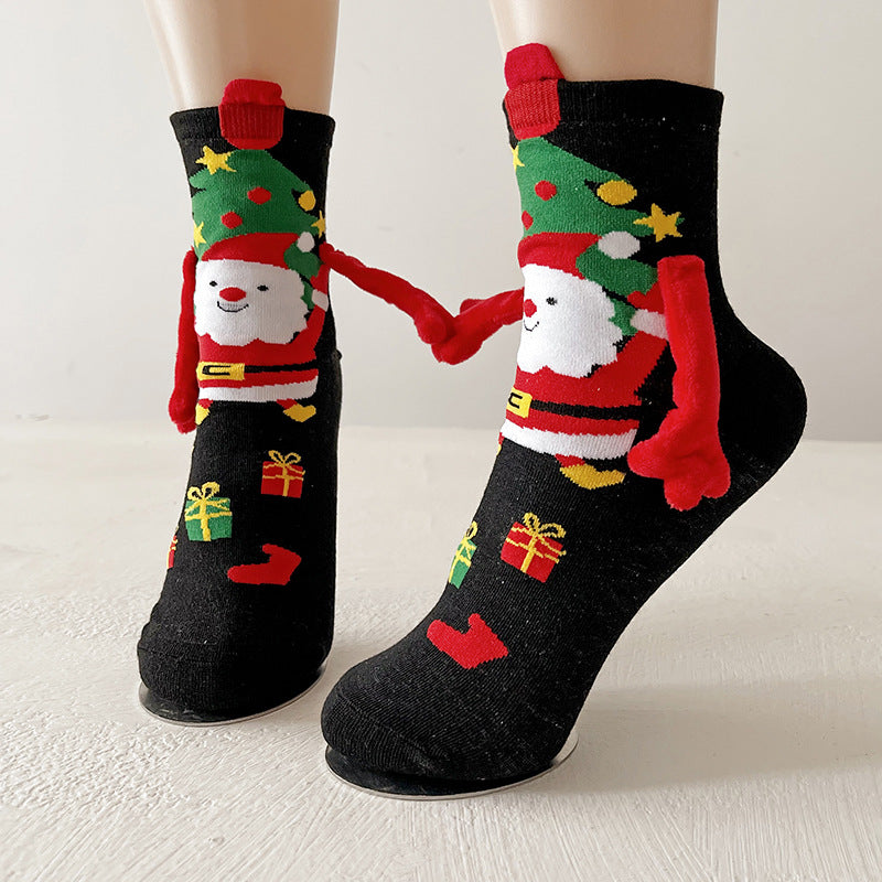 Couple wearing magnetic Christmas socks