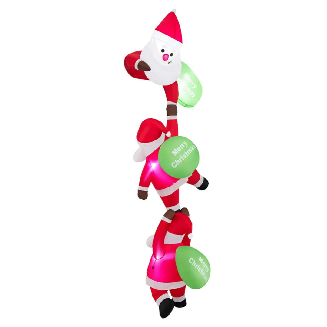 Three inflatable Santas climbing a balcony