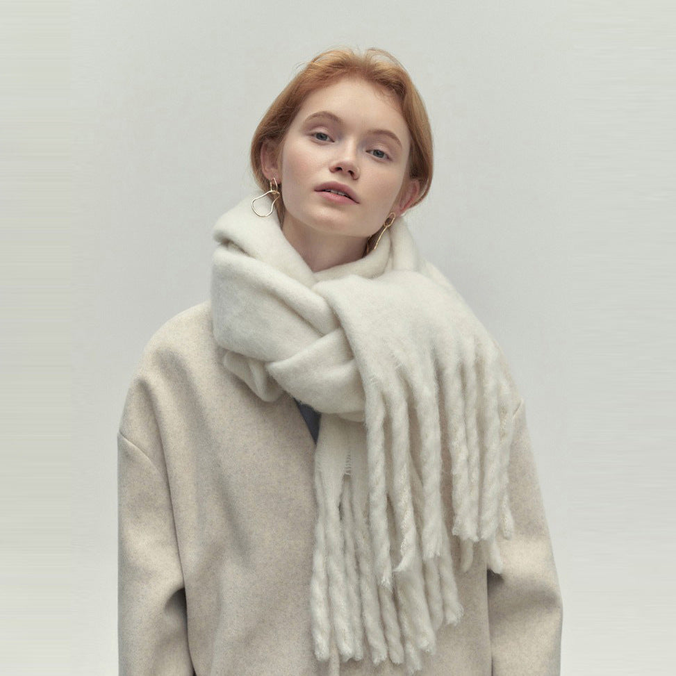 Woman wearing a long camel scarf
