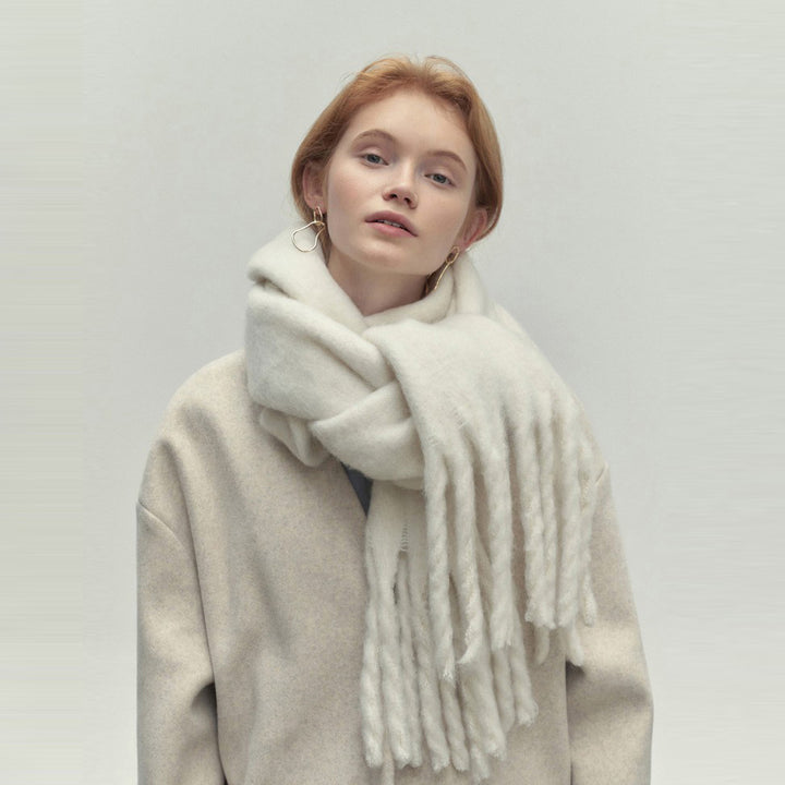 Woman wearing a long camel scarf