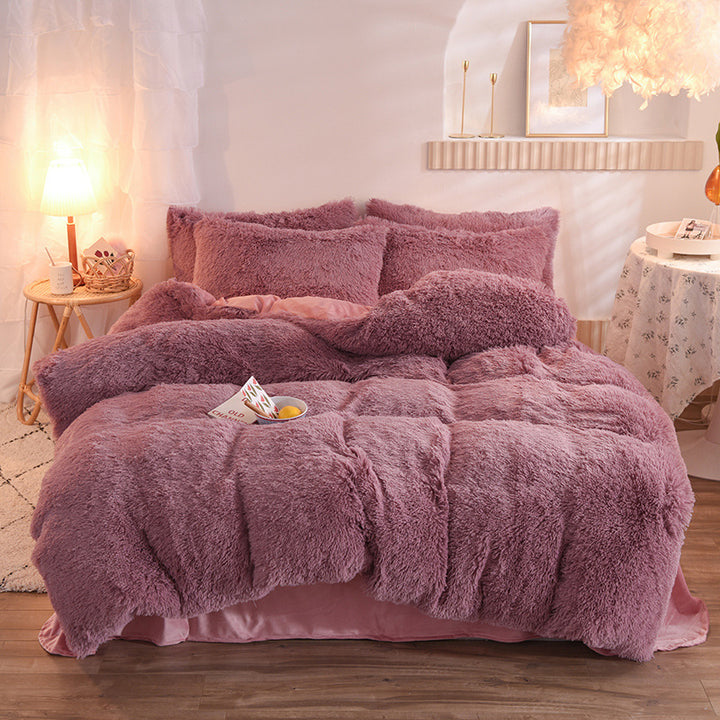 Fluffy plush bedding set on a bed