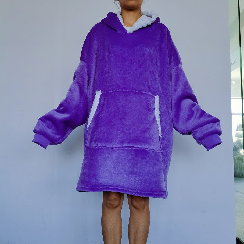 Person wearing an oversized blanket hoodie