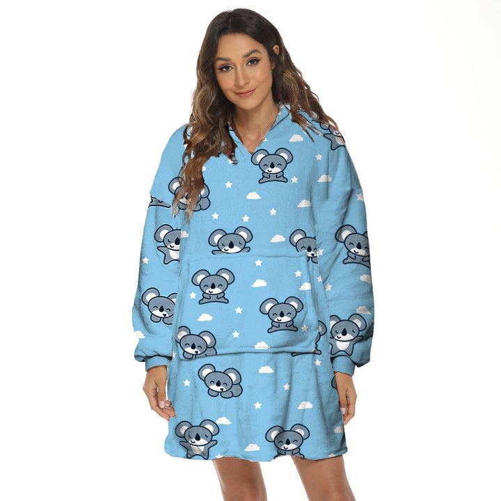 Person wearing oversized hooded blanket