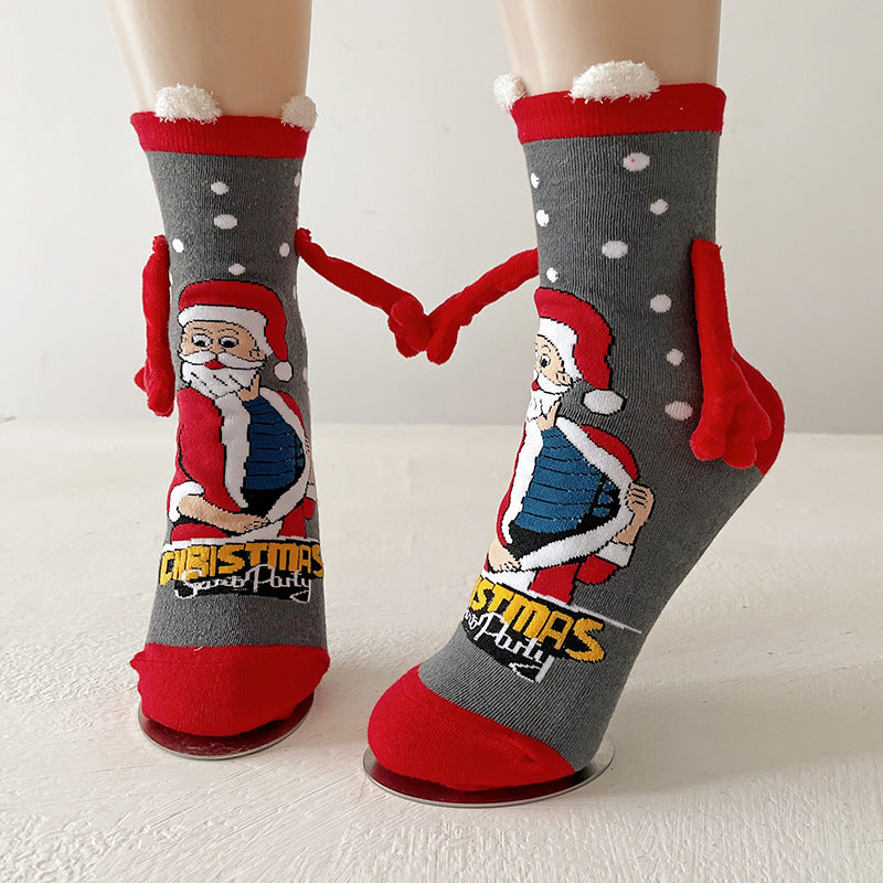 Couple wearing magnetic Christmas socks