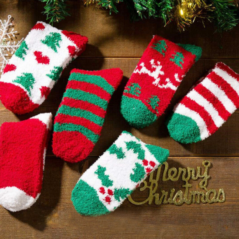 Five pairs of fuzzy Christmas socks