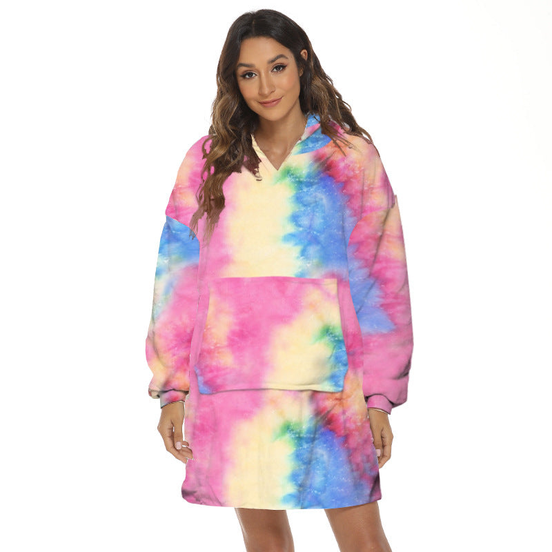 Person wearing oversized hooded blanket
