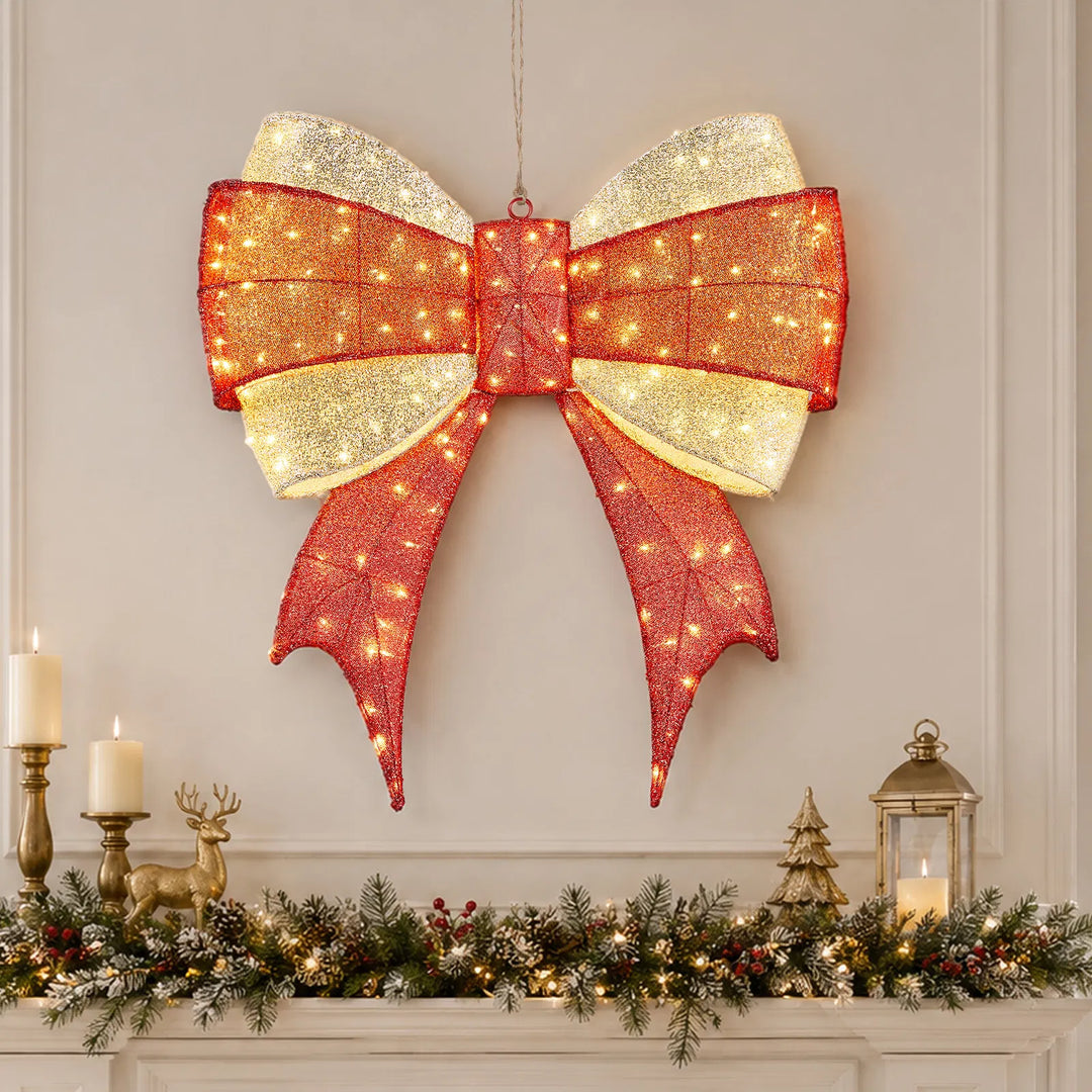Large lighted red and gold Christmas bow