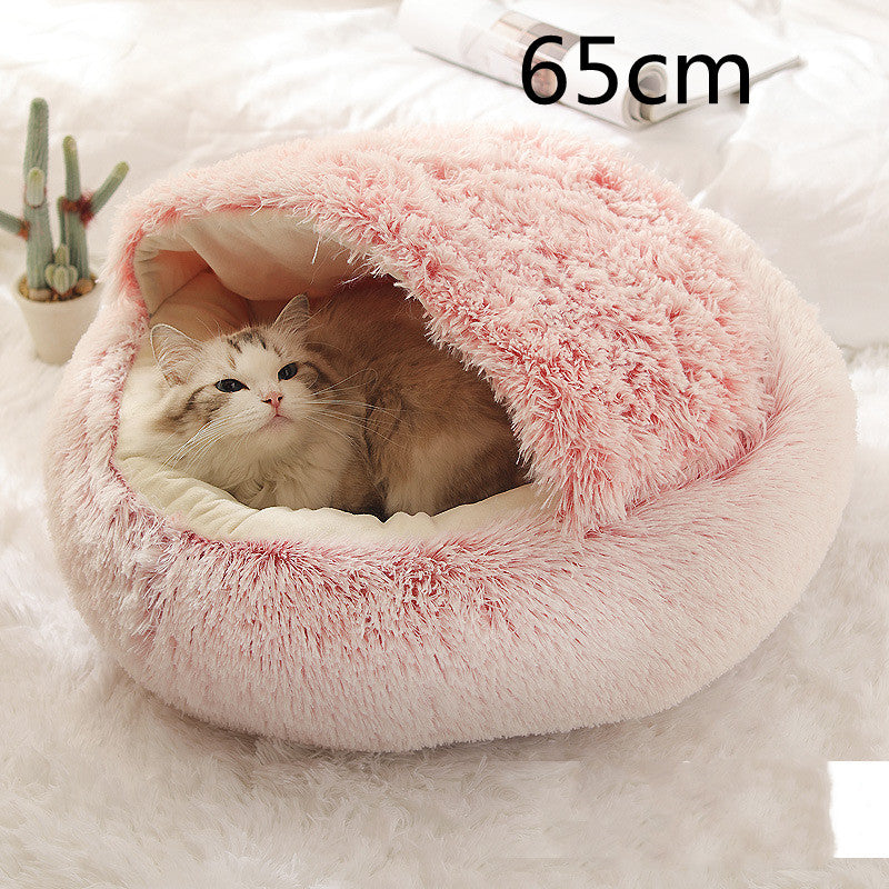 Cat curled up in a round plush bed with hood