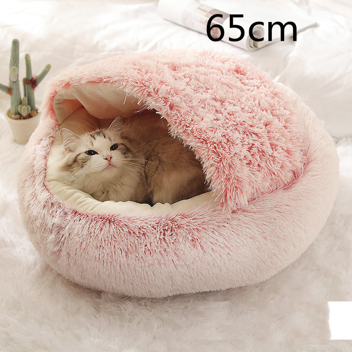 Cat curled up in a round plush bed with hood