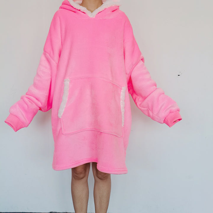 Person wearing an oversized blanket hoodie