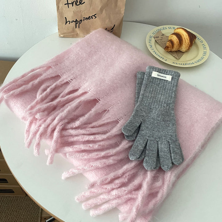 Woman wrapped in a fluffy oversized scarf
