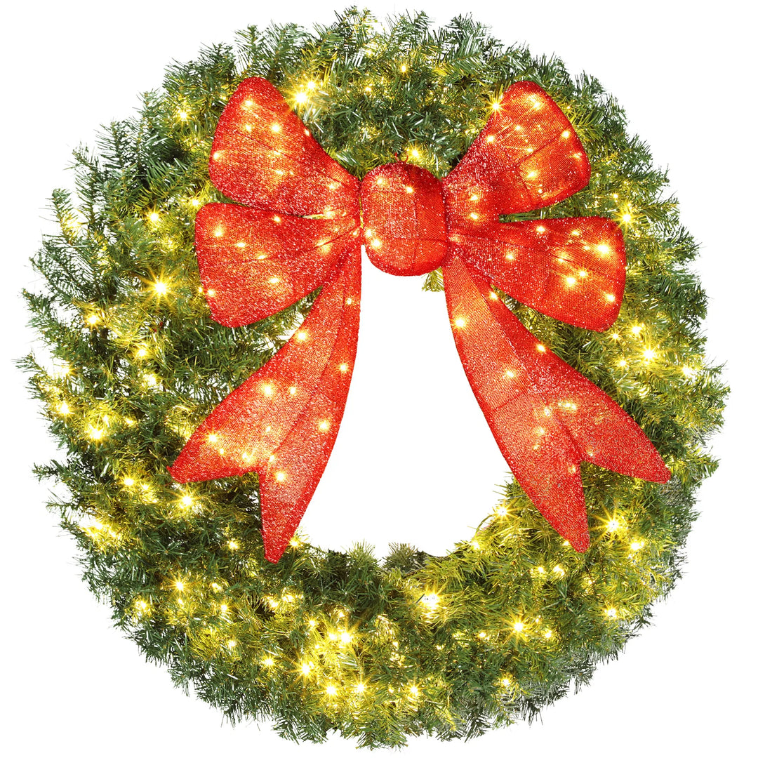 Giant lit Christmas wreath with red bow