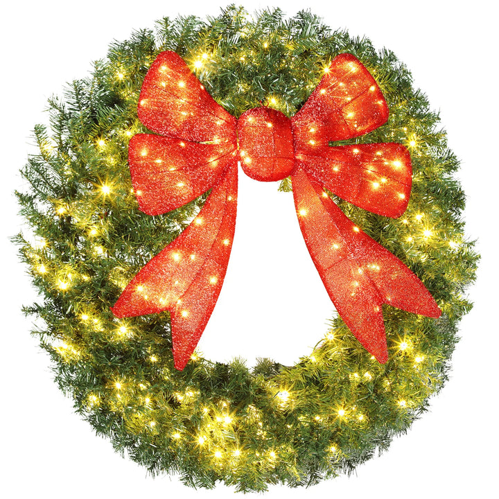 Giant lit Christmas wreath with red bow